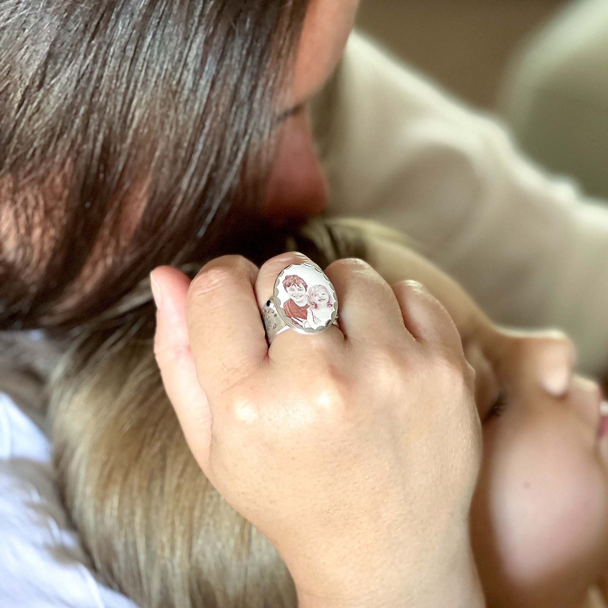 custom commission memorial ring with children's photo, footprints, handwritten names and birthstones.